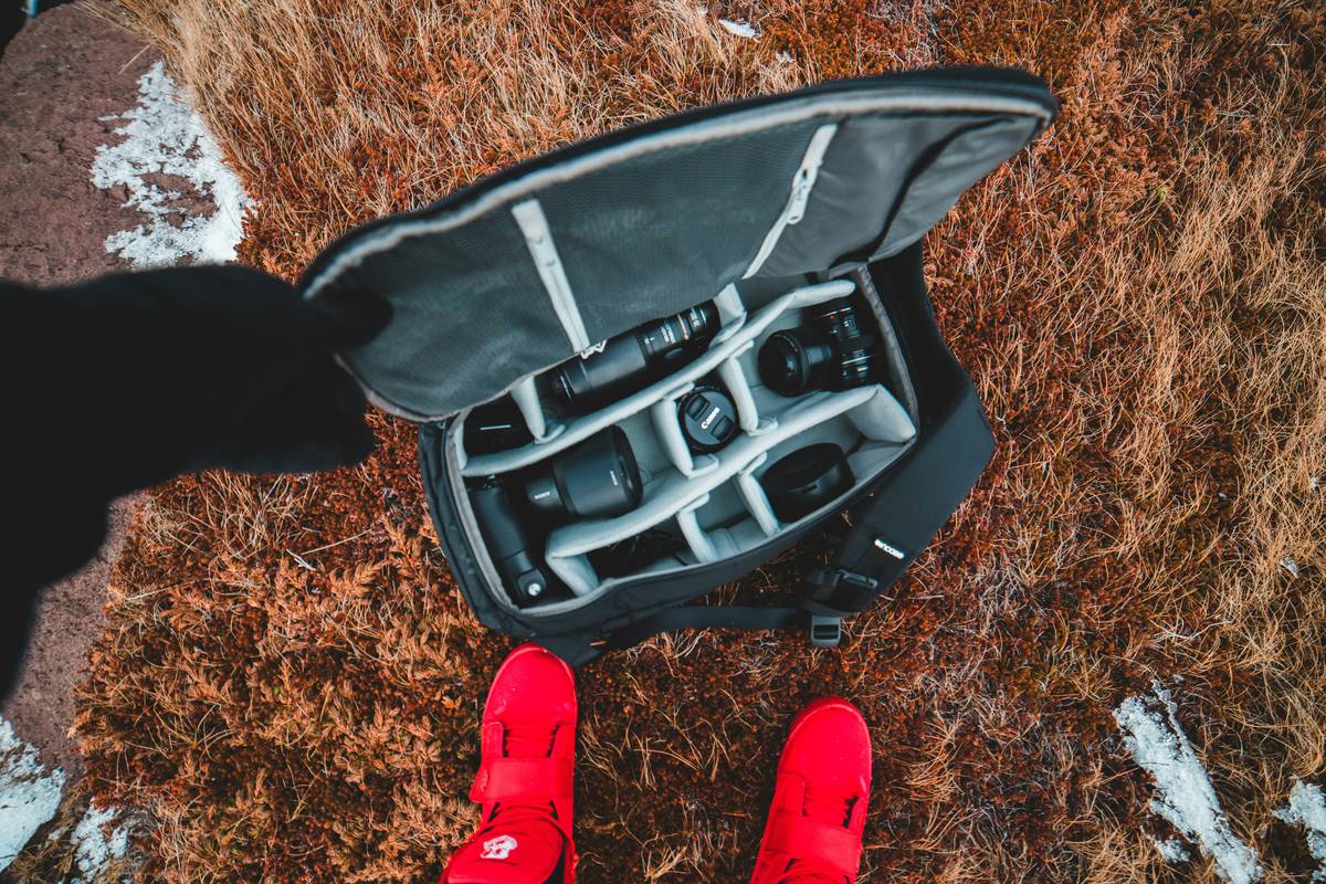 filmmaker using lightweight luggage for film gear at airport security checkpoint