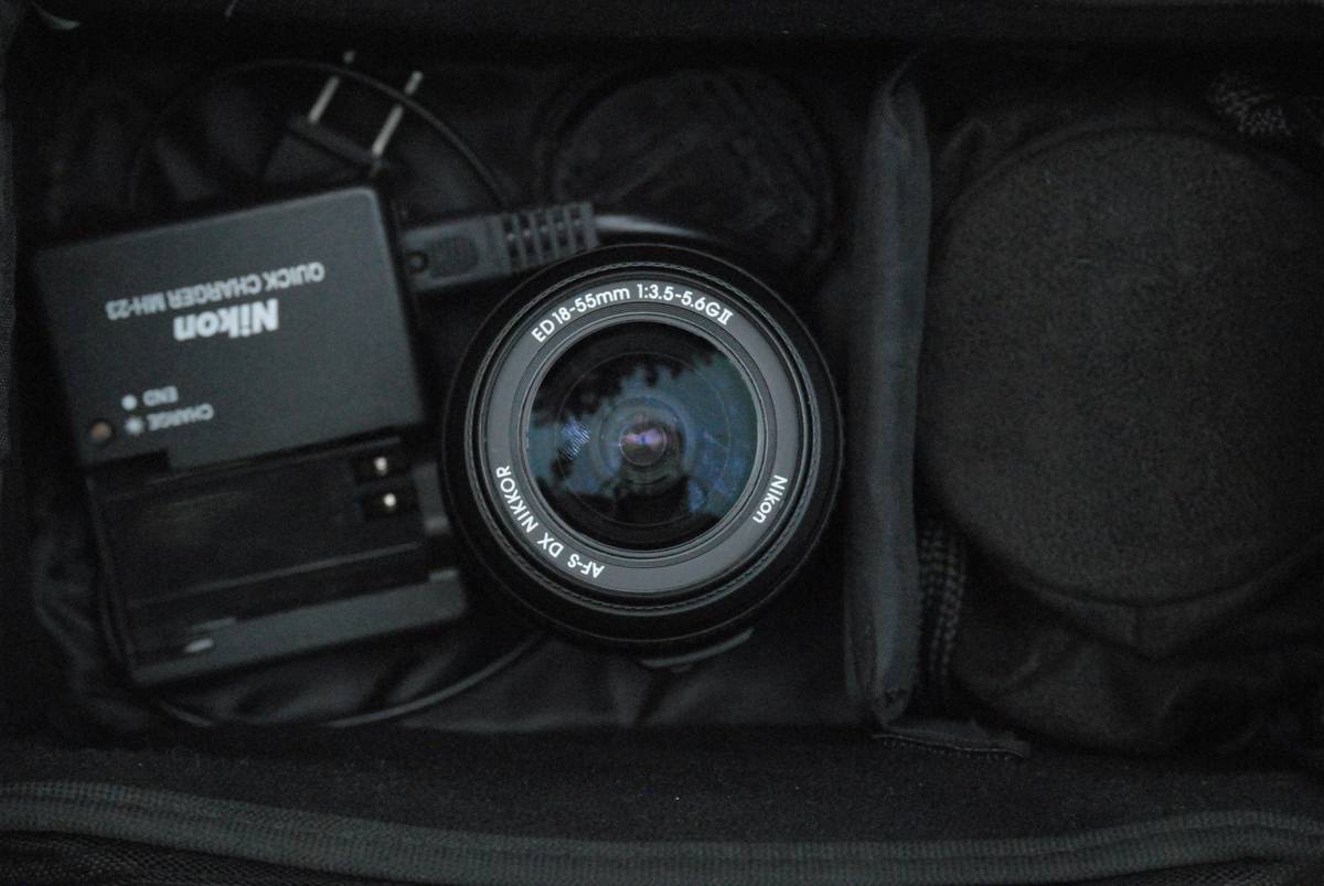 Side-by-side comparison of camera cage travel bag vs standard backpack showing protection difference