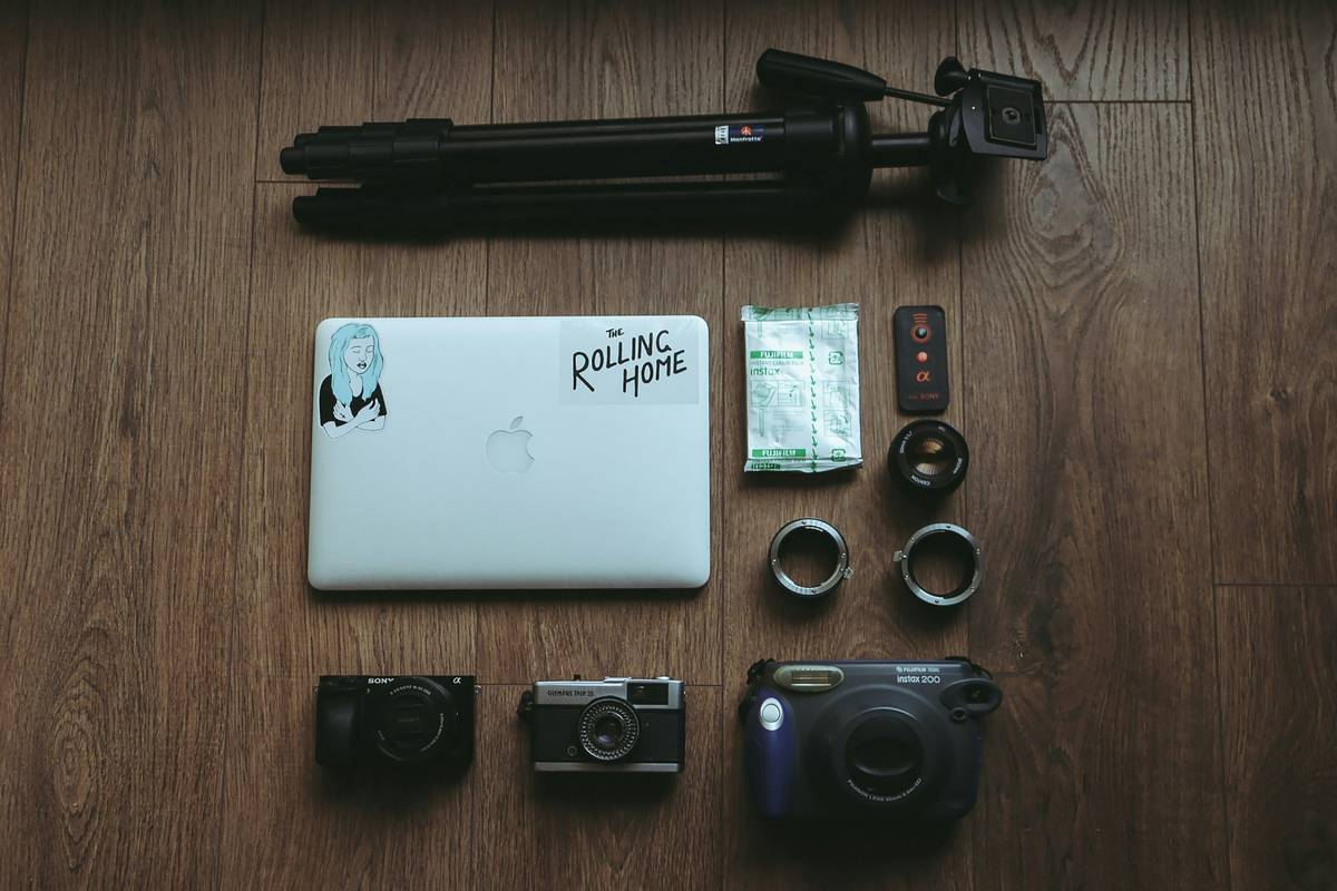 Vlogger using travel kit for smartphone vlogging while filming in a bustling European street